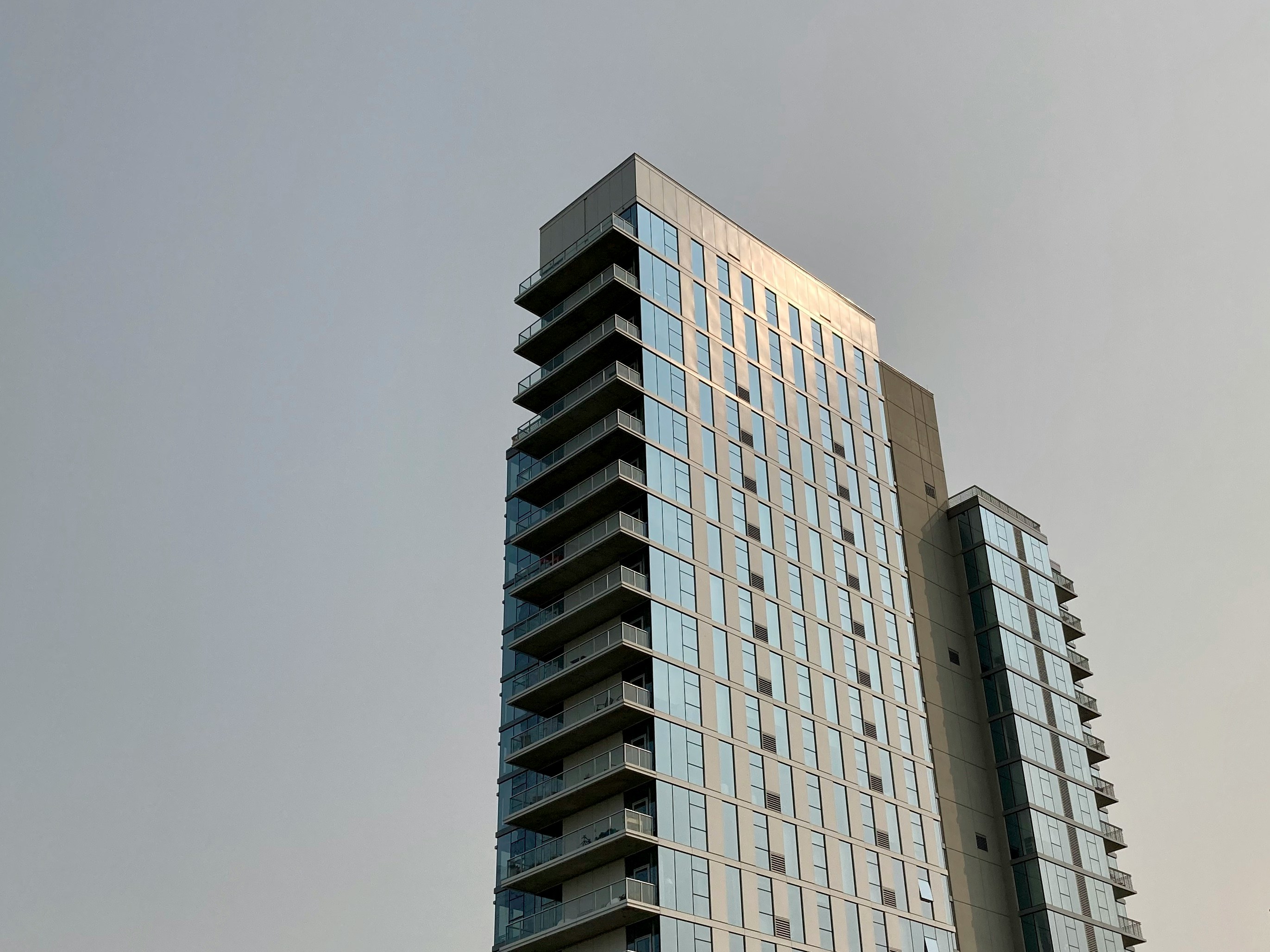  Image of a high-rise apartment with a penthouse suite at the top